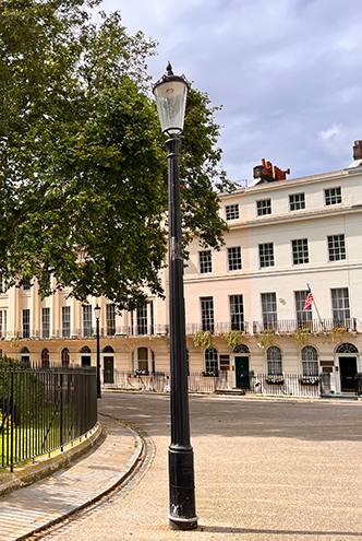 Quiet street of white Victorian townhouses in London