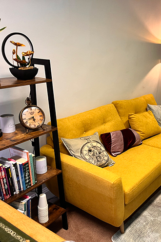 Therapist's office with yellow sofa and stylish décor 