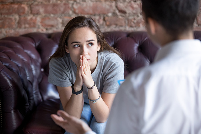 Concerned woman listening to therapist