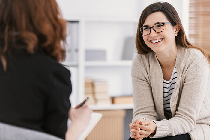 Smiling woman in therapy appointment